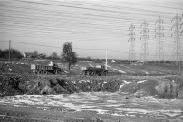 VILLEJUST.- La construction du tunnel du TGV : les camions sur le chantier du TGV, [vers 1987], N et B. Dim. 20 x 30 cm. 
