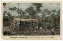SAINTE-GENEVIEVE-DES-BOIS. - Famille de bûcherons dans leur abri, en forêt de Séquigny [Editeur Thévenet]. 