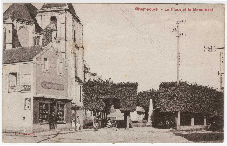 CHAMPCUEIL. - La place et le monument, Chaumier, 1933, 5 mots, 20 c, ad., sépia. 